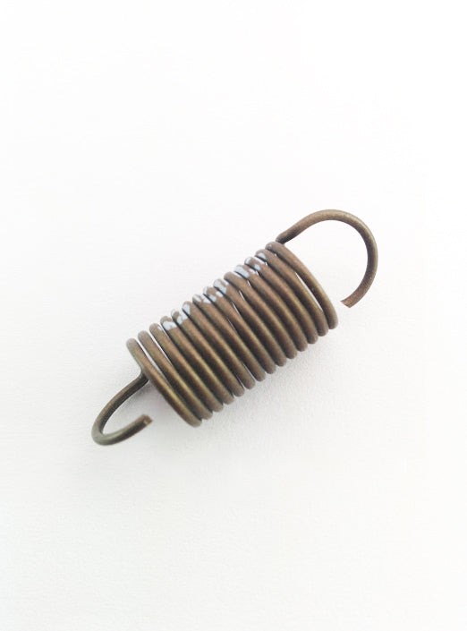 A close-up of a Dodge 89-93 3,200 RPM Governor Spring 12 Valve 5.9 Liter Dynomite Diesel isolated on a white background, showing detailed coils and ends of the spring.