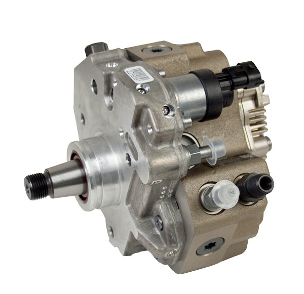 A Dynomite Diesel hydraulic pump featuring multiple input and output shafts with various fittings, set against a plain white background.